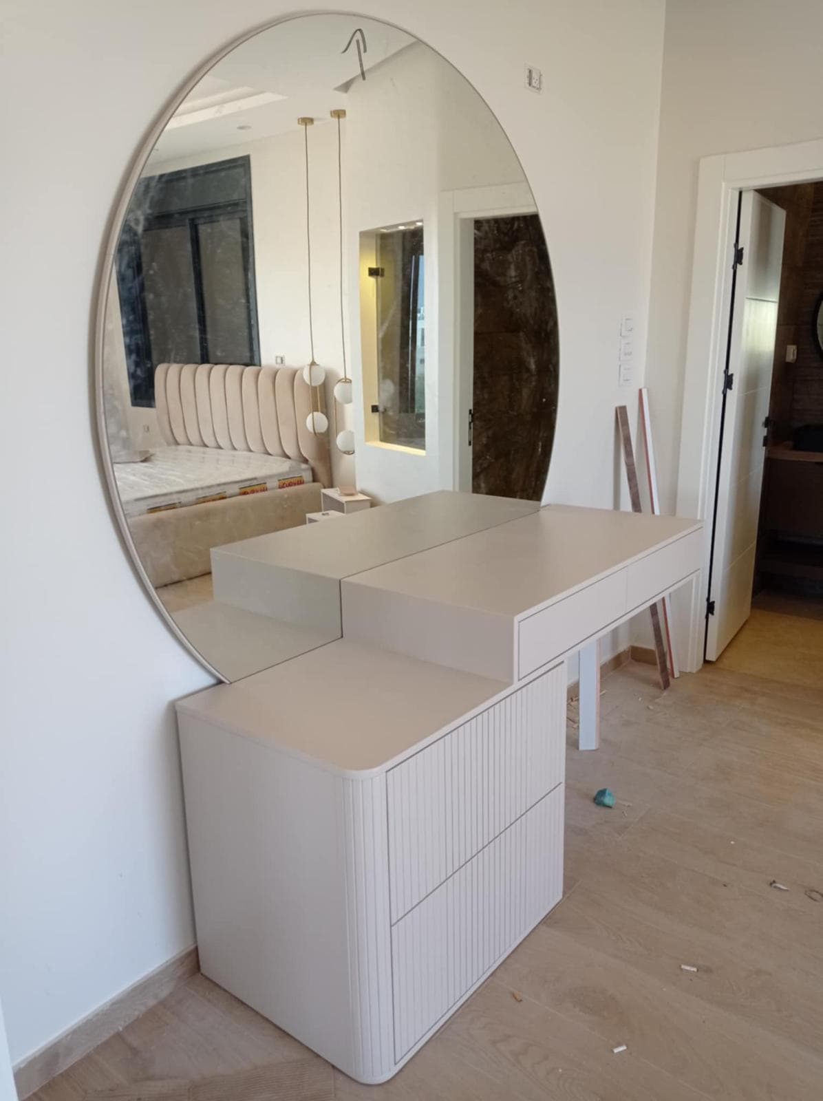 Desk and wall cabinets with fluted panels and gold trim