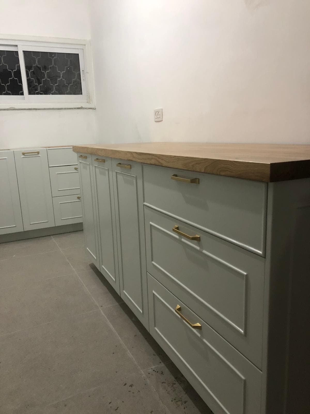 Blue-grey wardrobe with wood shelves and integrated desk