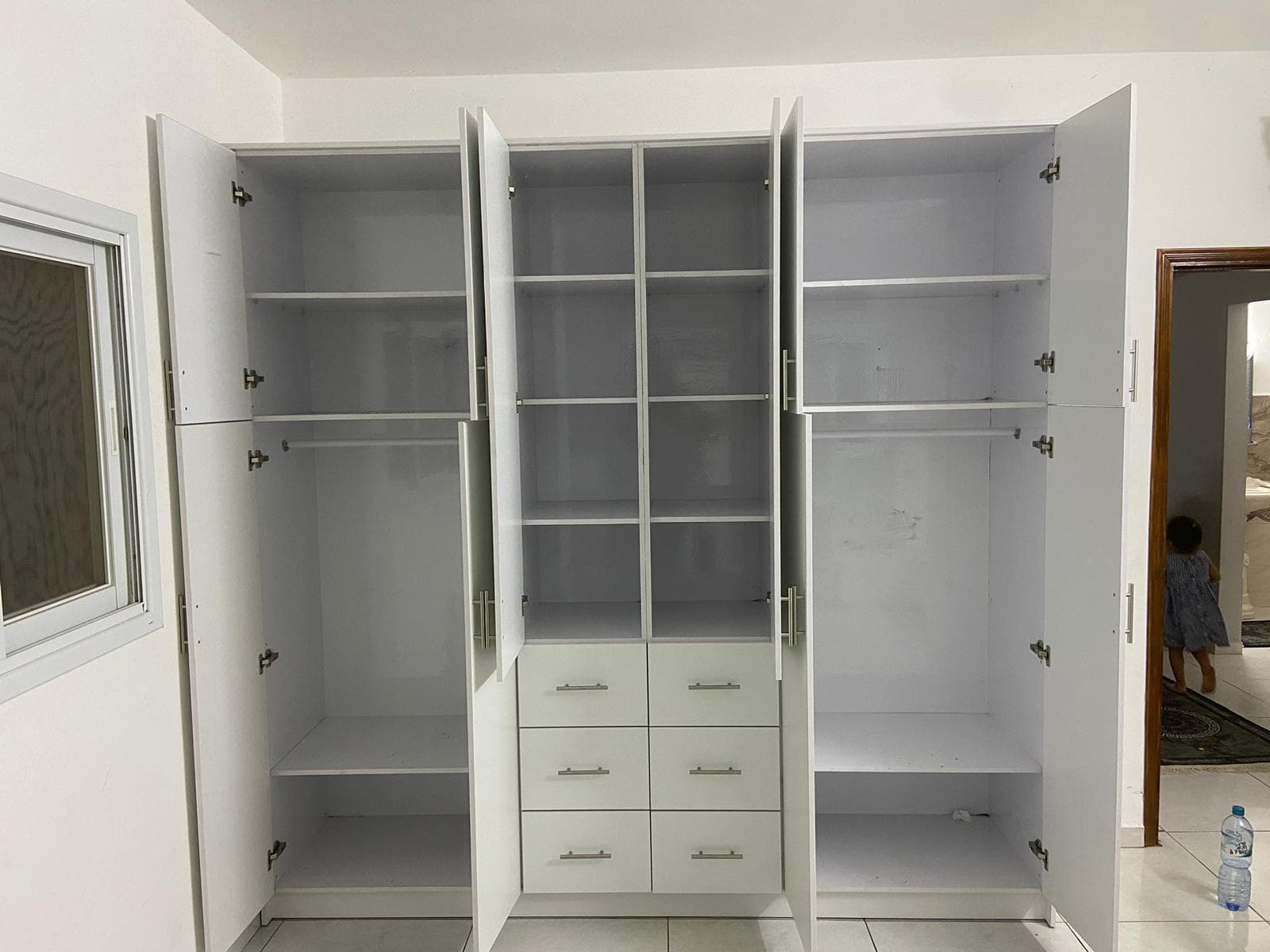 White storage unit with drawers and integrated wood desk
