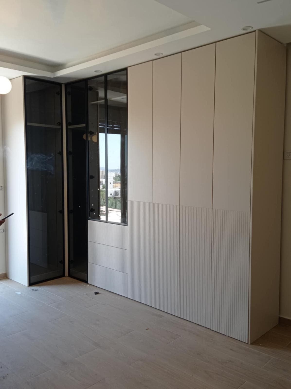 White wall wardrobe with dark wood frame and accent